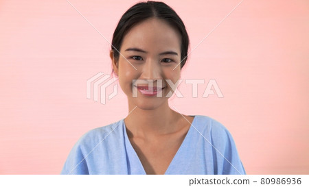 Portrait of young Asian woman merrily pose in studio Portrait of young Asian woman merrily pose in studio 80986936