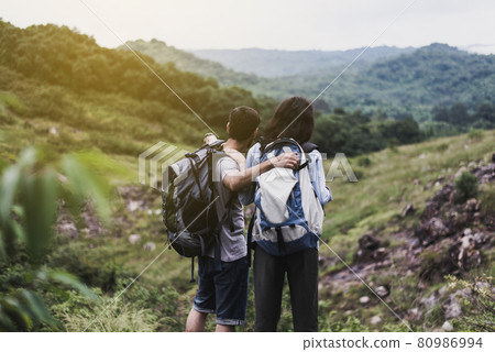 Couple lover standing and looking beautiful view feeling happy and smiling together,Enjoying camping in nature 80986994