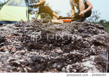 Blurred picture of couple lover cooking food for dinner outside tent together,Enjoying camping 80986995