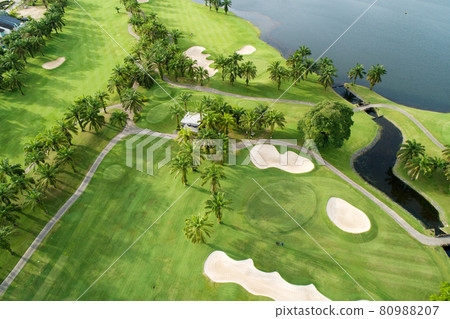Aerial view of the green golf course in Thailand Beautiful green grass and trees on a golf field with fairway and putting green in summer season 80988207