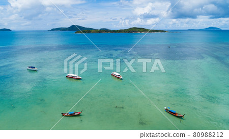 Aerial View of Thai traditional longtail fishing boats,sailing boats,yacht boats in the tropical sea beautiful island seashore in phuket thailand. 80988212