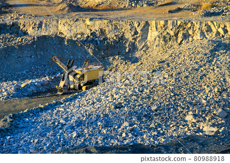 Heavy machinery in the granite quarry 80988918