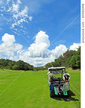 Summer golf green fairway and white clouds in the blue sky Summer golf green fairway and white clouds in the blue sky 80988996