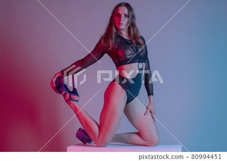 young woman pole dancer posing on a cube in the style of synch wave young woman pole dancer posing on a cube in the style of synch wave 80994451