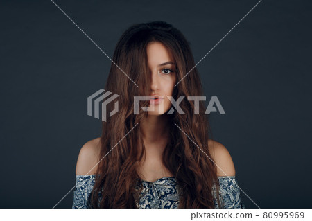 Portrait of beautiful young brunette woman with healthy hair 80995969