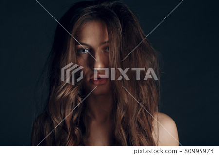 Portrait of beautiful young brunette woman with healthy hair Portrait of beautiful young brunette woman with healthy hair 80995973