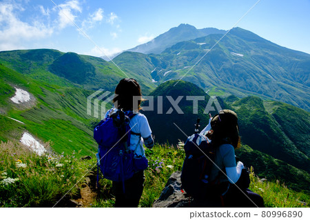 A mountain girl looking up at Mt. Chokai (Dewa Fuji), a famous peak representing the Tohoku region A mountain girl looking up at Mt. Chokai (Dewa Fuji), a famous peak representing the Tohoku region 80996890