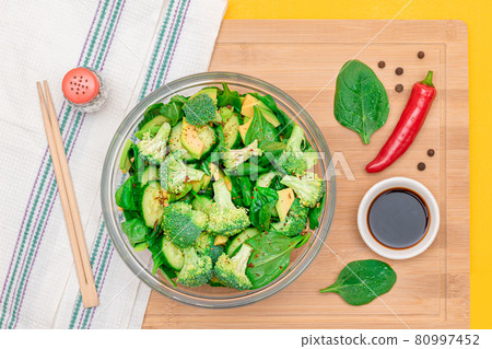 Fresh Green Salad of Avocado, Broccoli, Spinach and Cucumber Fresh Green Salad of Avocado, Broccoli, Spinach and Cucumber 80997452