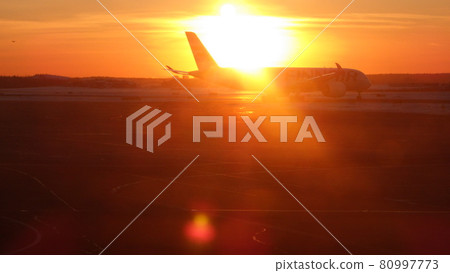 Airplane in the sunset back Airplane in the sunset back 80997773