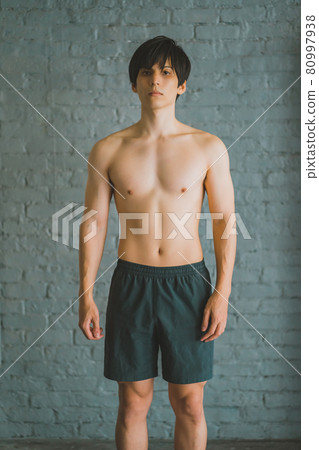 Shirtless man in shorts Shirtless man in shorts 80997938