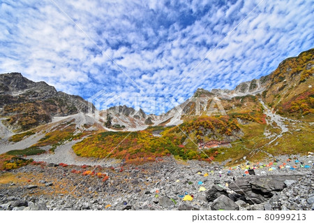 Karasawa Cirque at the peak of autumn colors Looking up from the tent site Okuhotakadake, Karasawadake, Kitahotakadake Karasawa Cirque at the peak of autumn colors Looking up from the tent site Okuhotakadake, Karasawadake, Kitahotakadake 80999213