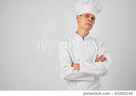 man in chef's clothes professional kitchen work 81000240