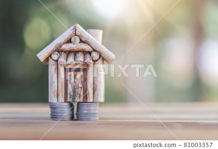 House placed on coins. Indicates saving money for home and the growth of home business. House placed on coins. Indicates saving money for home and the growth of home business. 81003357