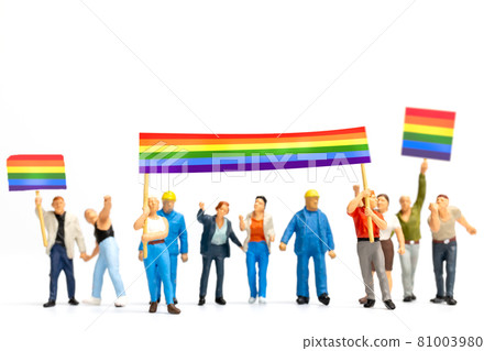 Miniature people Protester holding a transgender flag sign encouraging social distancing Miniature people Protester holding a transgender flag sign encouraging social distancing 81003980