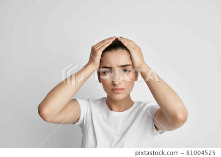 woman in white t-shirt health problems headache stress emotions 81004525