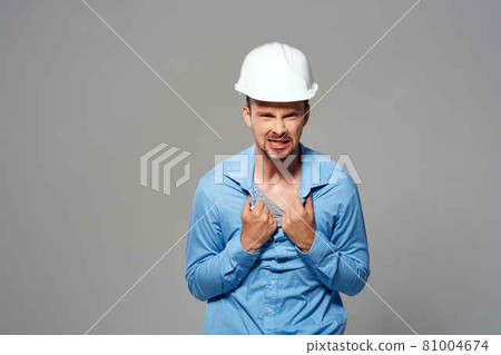 Cheerful male engineer construction helmet on his head safety work Cheerful male engineer construction helmet on his head safety work 81004674