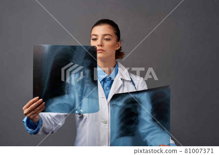 woman radiologist with x-ray diagnostics research to professionals woman radiologist with x-ray diagnostics research to professionals 81007371