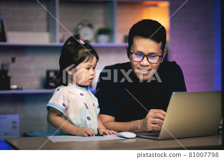 freelancer man working with laptop on the table and talking with his daughter freelancer man working with laptop on the table and talking with his daughter 81007798
