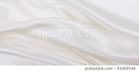 Smooth elegant white silk or satin luxury cloth texture as wedding background. Luxurious background design Smooth elegant white silk or satin luxury cloth texture as wedding background. Luxurious background design 81008546