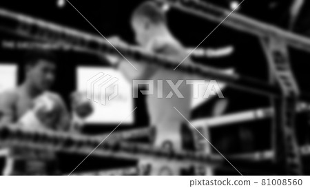 Thai Kick boxing. Blurred images of Muay Thai. Martial Art Kickboxing. Local and foriegn boxer are fighting on the ring at stadium stage. Muaythai is sport competition for traveller sightseeing. Thai Kick boxing. Blurred images of Muay Thai. Martial Art Kickboxing. Local and foriegn boxer are fighting on the ring at stadium stage. Muaythai is sport competition for traveller sightseeing. 81008560