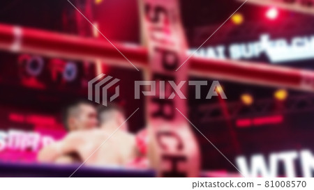 Thai Kick boxing. Blurred images of Muay Thai. Martial Art Kickboxing. Local and foriegn boxer are fighting on the ring at stadium stage. Muaythai is sport competition for traveller sightseeing. 81008570