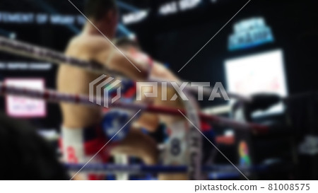 Thai Kick boxing. Blurred images of Muay Thai. Martial Art Kickboxing. Local and foriegn boxer are fighting on the ring at stadium stage. Muaythai is sport competition for traveller sightseeing. Thai Kick boxing. Blurred images of Muay Thai. Martial Art Kickboxing. Local and foriegn boxer are fighting on the ring at stadium stage. Muaythai is sport competition for traveller sightseeing. 81008575