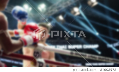 Thai Kick boxing. Blurred images of Muay Thai. Martial Art Kickboxing. Local and foriegn boxer are fighting on the ring at stadium stage. Muaythai is sport competition for traveller sightseeing. Thai Kick boxing. Blurred images of Muay Thai. Martial Art Kickboxing. Local and foriegn boxer are fighting on the ring at stadium stage. Muaythai is sport competition for traveller sightseeing. 81008578