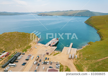 A ferry from the east coast to Olkhon Island Khuzhir at sunrise. Lake Baikal. From the side of the island. 81008605