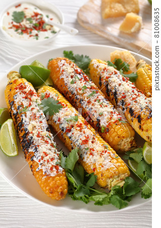 Elote, Grilled Mexican Street Corn on a plate 81008635