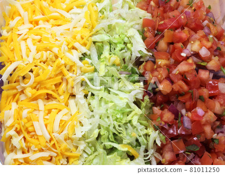 Cheese, Lettuce and Tomato for Fajitas Dinner close up 81011250