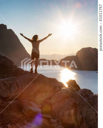 Adventurous Caucasian Adult Woman Hiking on top of a Canadian Rocky Mountain Adventurous Caucasian Adult Woman Hiking on top of a Canadian Rocky Mountain 81011767