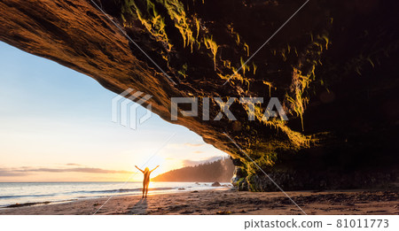 Adventurous Woman at Mystic Beach on the West Coast of Pacific Ocean Adventurous Woman at Mystic Beach on the West Coast of Pacific Ocean 81011773