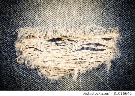 Vintage jeans torn denim texture. 81016645