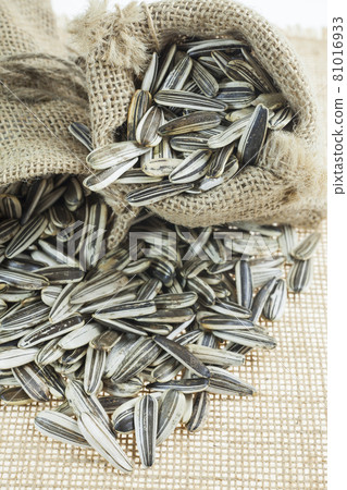 Sunflower seeds in sacks. Sunflower seeds in sacks. 81016933