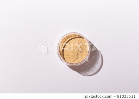 Mineral powder foundation isolated on a white background. Eco-friendly and organic beauty products Mineral powder foundation isolated on a white background. Eco-friendly and organic beauty products 81023511