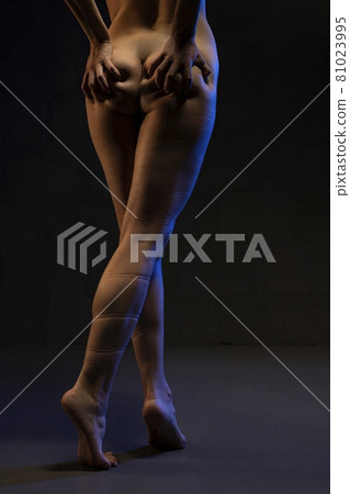 Anonymous woman with traces of rope on naked body 81023995