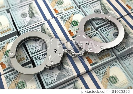Handcuffs on dollar packs. Illegal money, corruption and bribe concept. 81025293