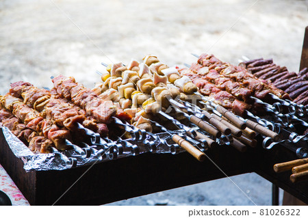 Meat and potatoes prepared for frying on skewers. Meat and potatoes prepared for frying on skewers. 81026322