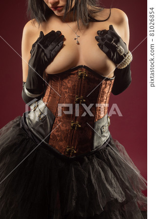 sexy woman posing topless corset burlesque covering her breasts with her hands sexy woman posing topless corset burlesque covering her breasts with her hands 81026854