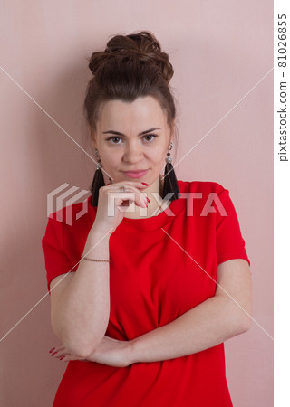 Beautiful woman in red dress posing against the wall in rococo style Beautiful woman in red dress posing against the wall in rococo style 81026855