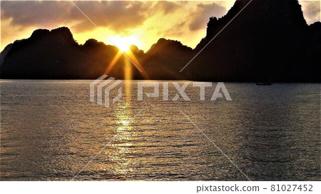 Beautiful sunset in Halong Bay seen from the ship-Vietnam's World Heritage Site 81027452