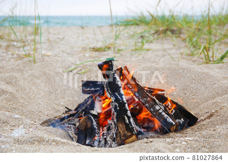Bonfire on beach. Concept of summer vacation. Bonfire on beach. Concept of summer vacation. 81027864