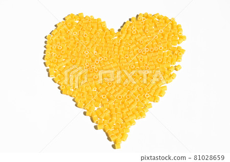 Heart shaped, raw fresh and healthy macaroni pasta foot background Heart shaped, raw fresh and healthy macaroni pasta foot background 81028659