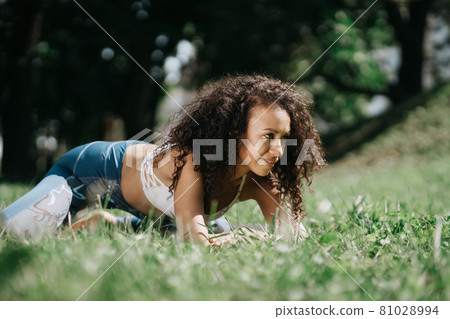 athletic young woman relaxing after a workout . athletic young woman relaxing after a workout . 81028994