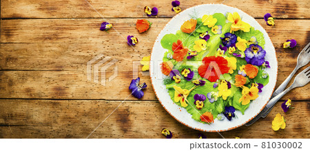 Edible flower salad in the plate,copy space Edible flower salad in the plate,copy space 81030002