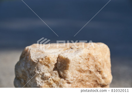 The concept of a summer layout for a product presentation. The platform is made of beige stone on the asphalt. 81032011