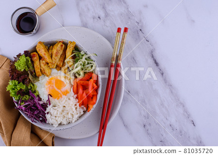 Korean Bibimbap. Bowl with meat, rice and salad Korean Bibimbap. Bowl with meat, rice and salad 81035720