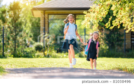 Girls with backpack are going to school Girls with backpack are going to school 81038496