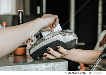 Customer doing payment credit card in cafe or shop Customer doing payment credit card in cafe or shop 81039470