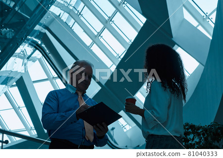 business colleagues making clarifications in the new contract . 81040333